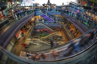 time lapse photography of crowded people on mall grounds