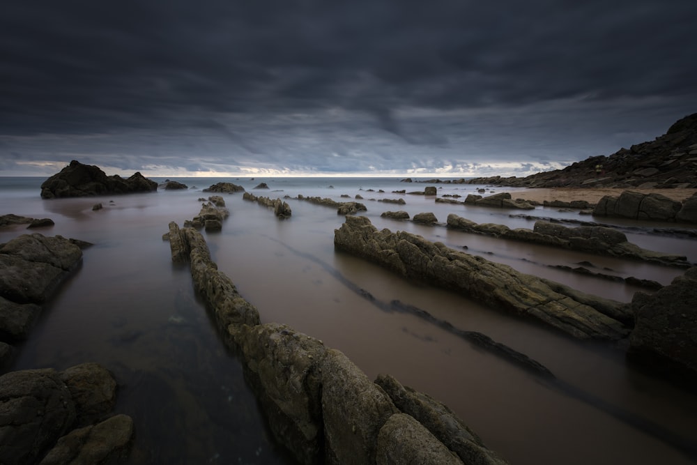 rock formation on body of water