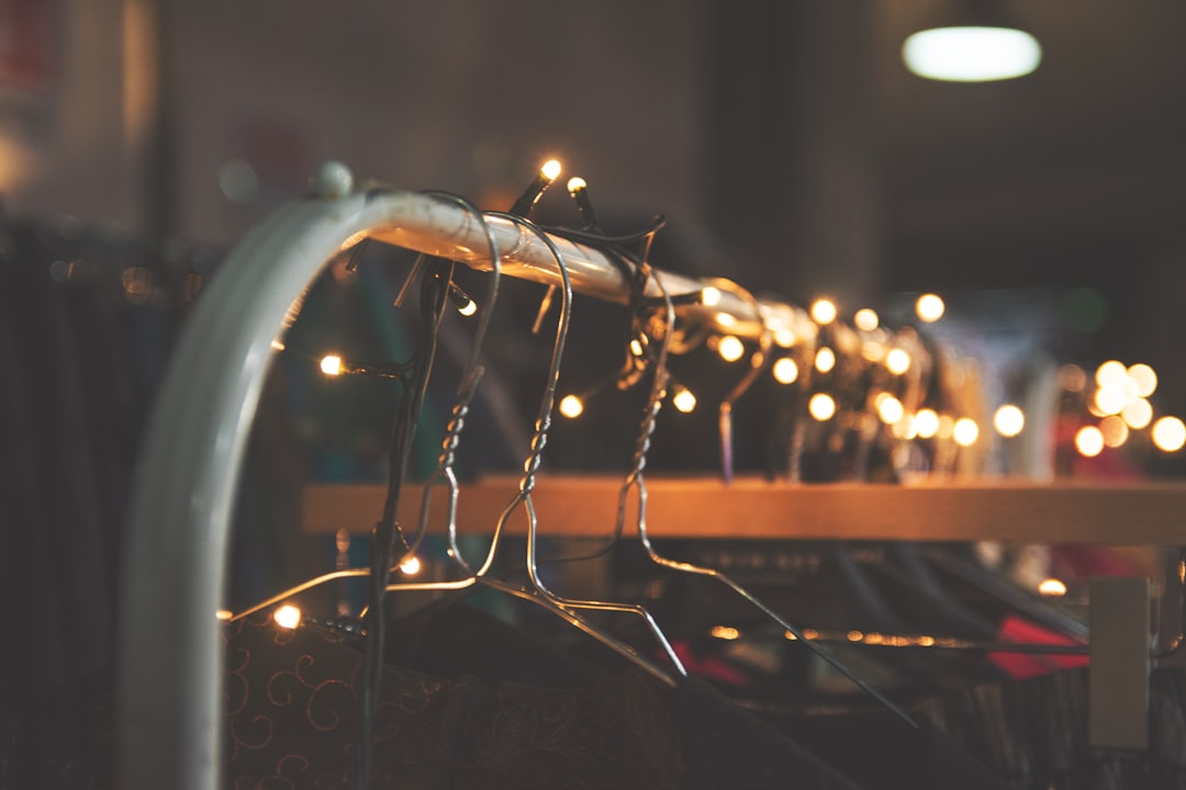 silver clothes hangers with string lights