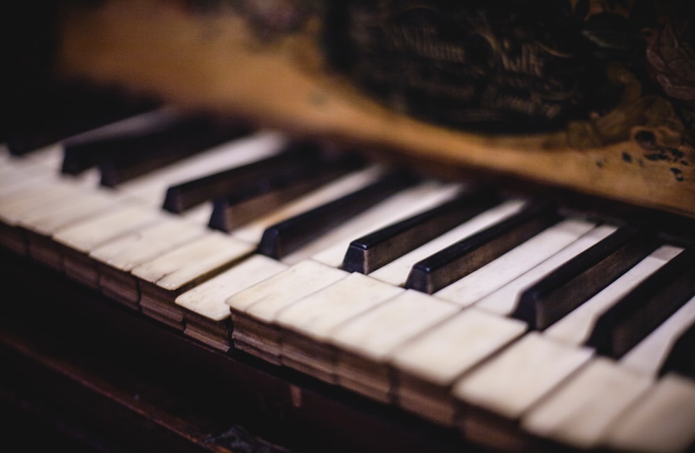 close up photo of white and black piano keys