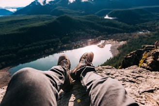 person sitting on mountain