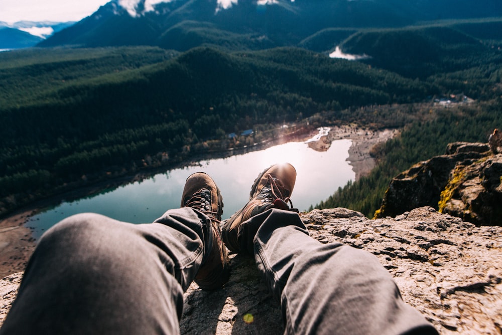 person sitting on mountain