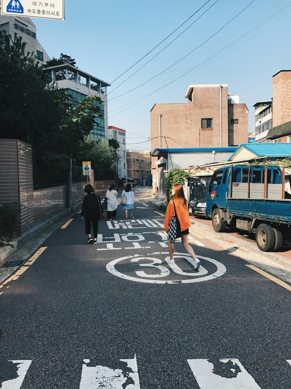 woman crossing the road