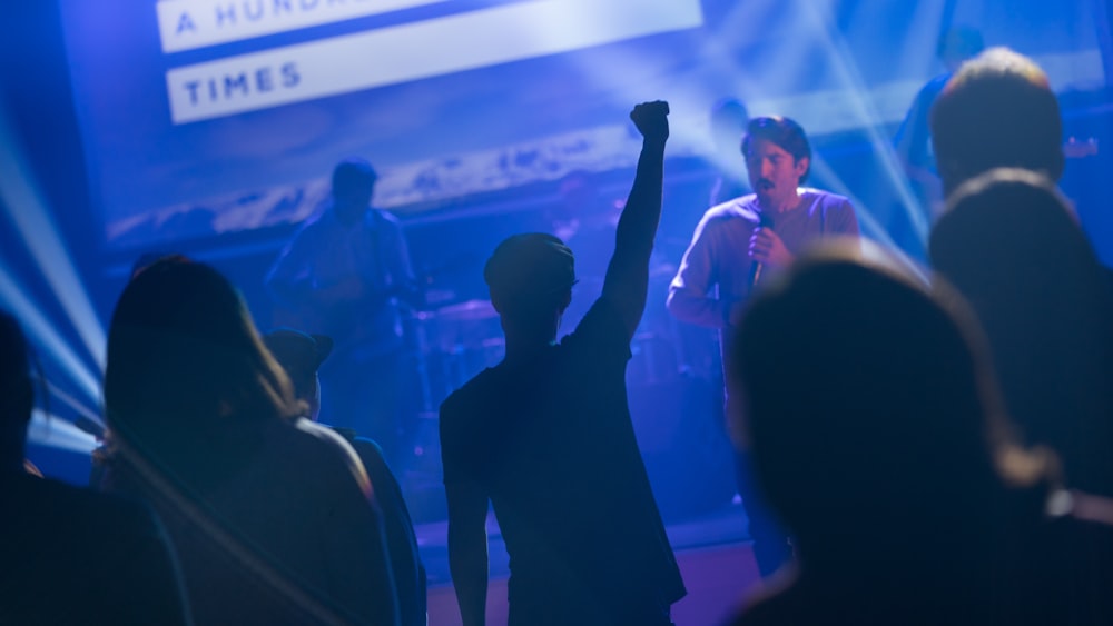 silhouette of crowd watching performing male band