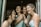 A joyful gathering of women sharing stories and laughter.