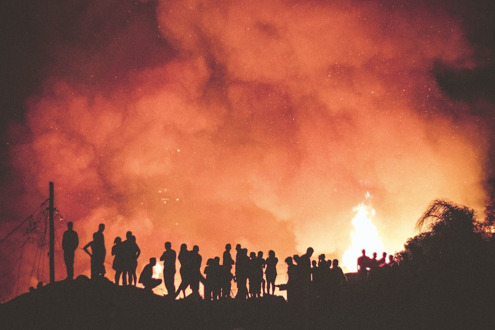 people near bonfire during night