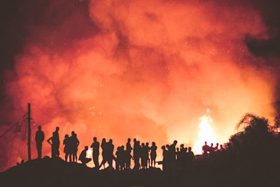 people near bonfire during night fire google meet background