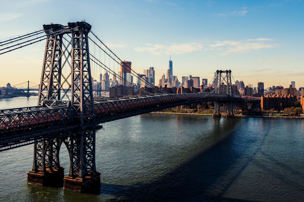 gray steel bridge above body of water