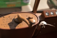 Close-up of a vending machine control panel being serviced with tools.