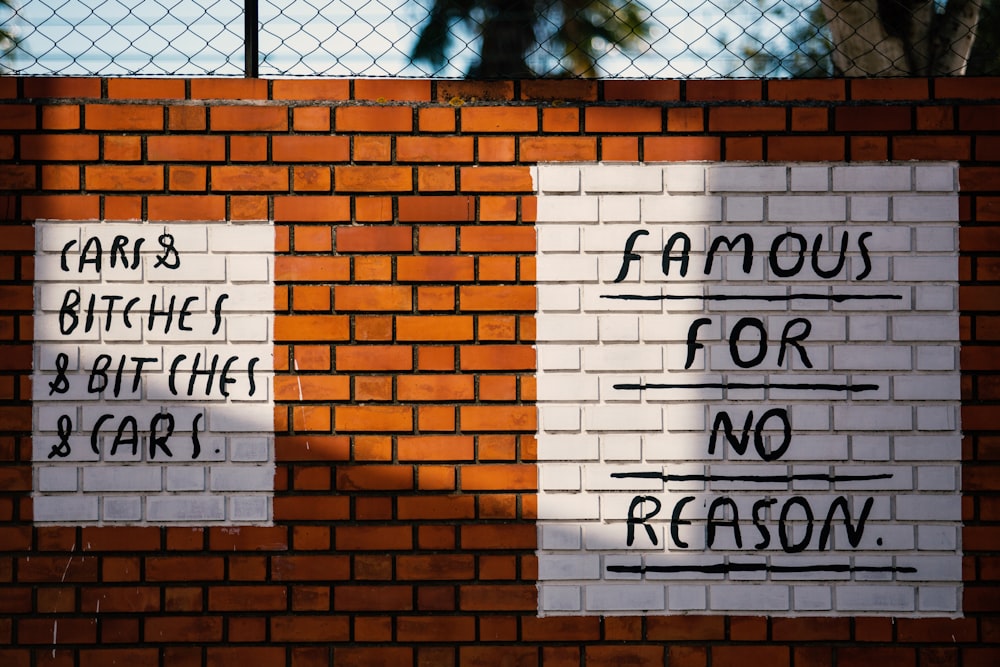 white and brown text-printed concrete wall