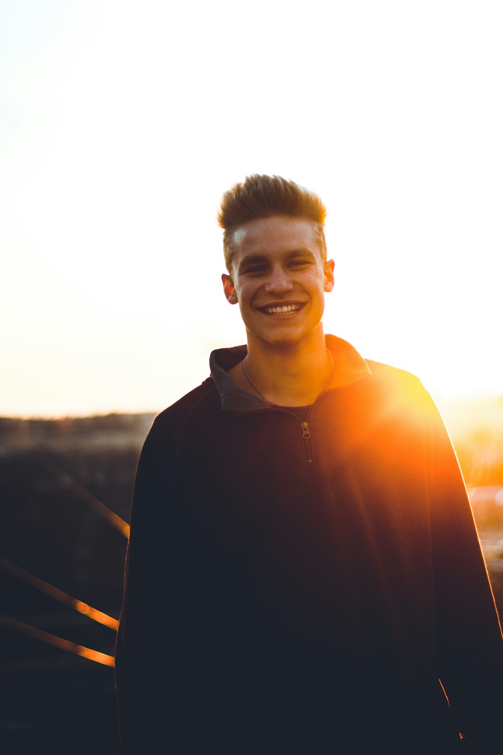 man in black sweater smiling