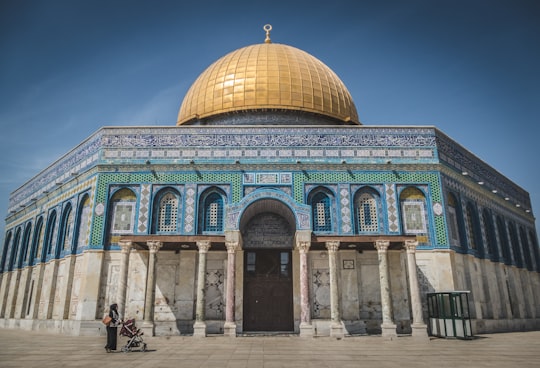 brown and green mosque under blue sky in Dome of the Rock Israel