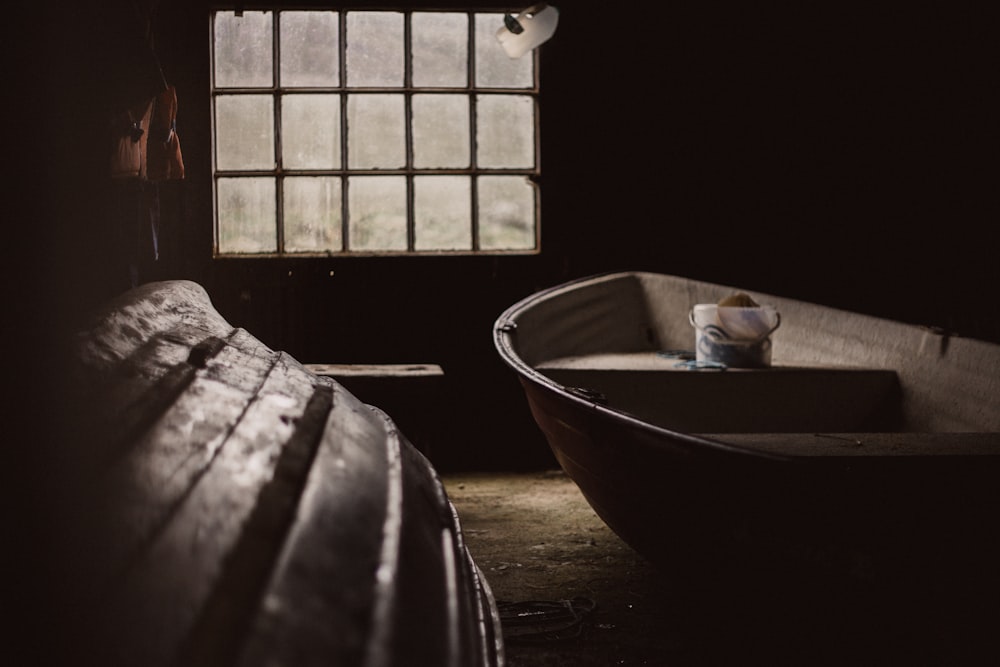 two brown boats near window