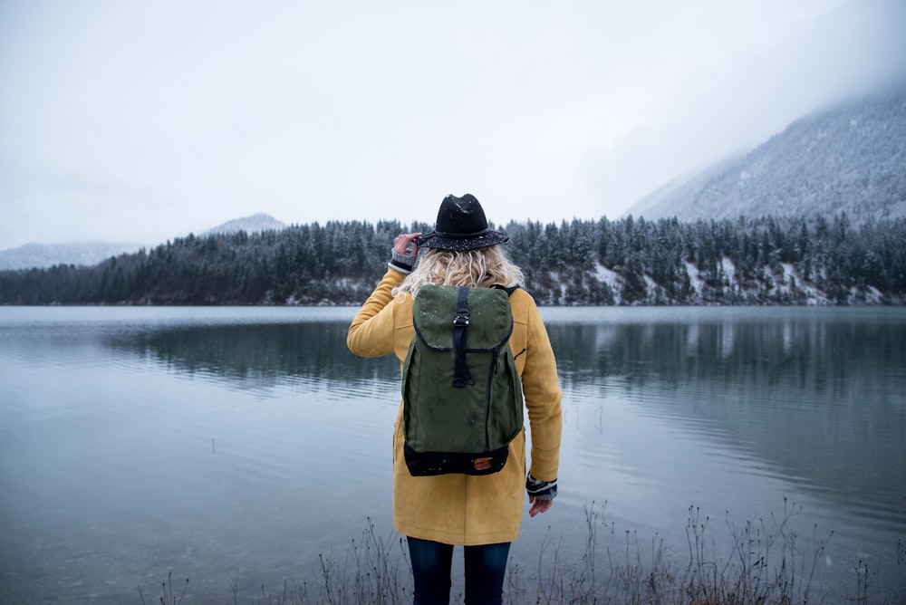 woman standing near body of water