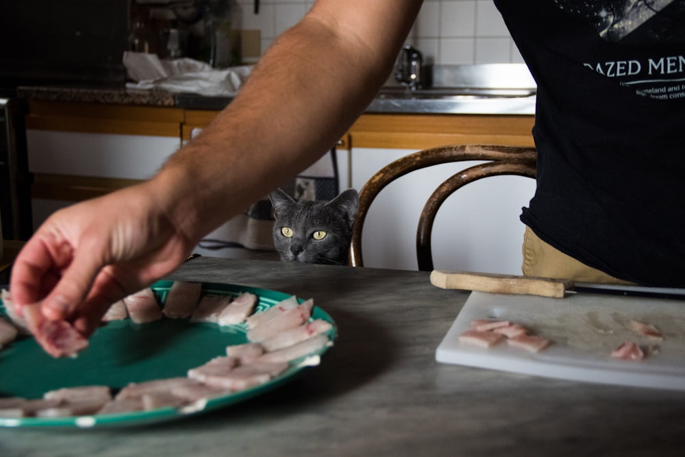 person chopping some meats