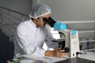 man sight on white microscope