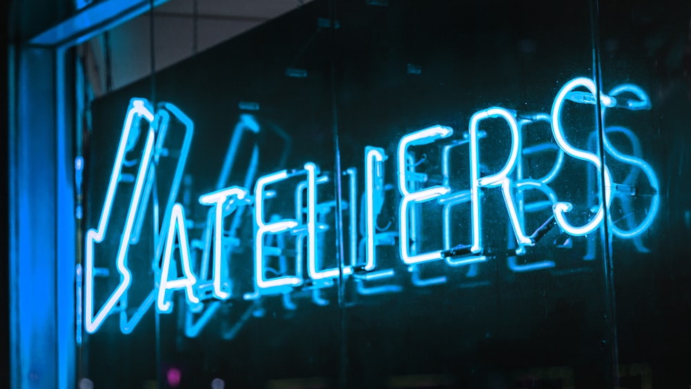 Ateliers neon signage on wall