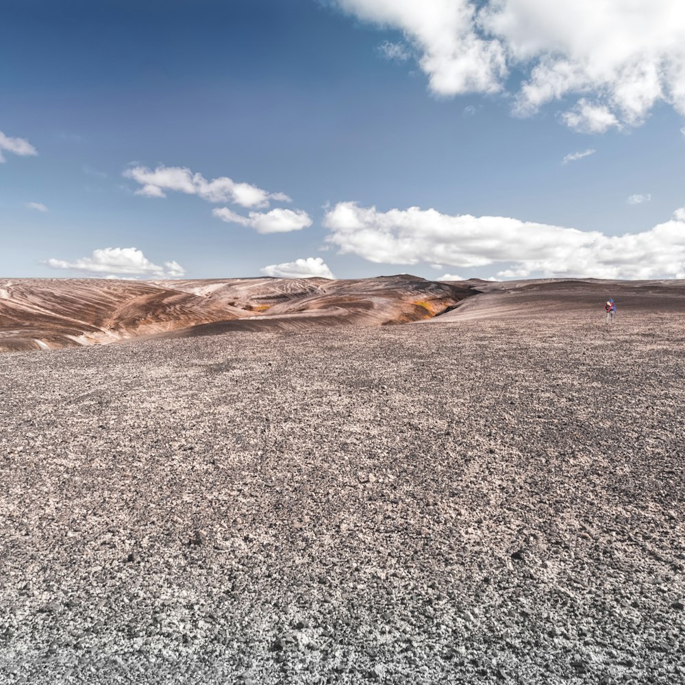 person walking on mountain top during daytime