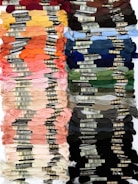 Colorful threads and fabrics arranged neatly on a table.