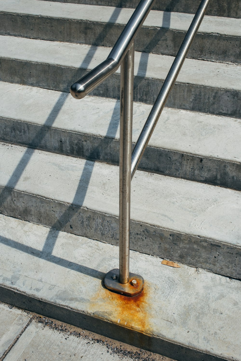 rust at the base of handrails on stairs