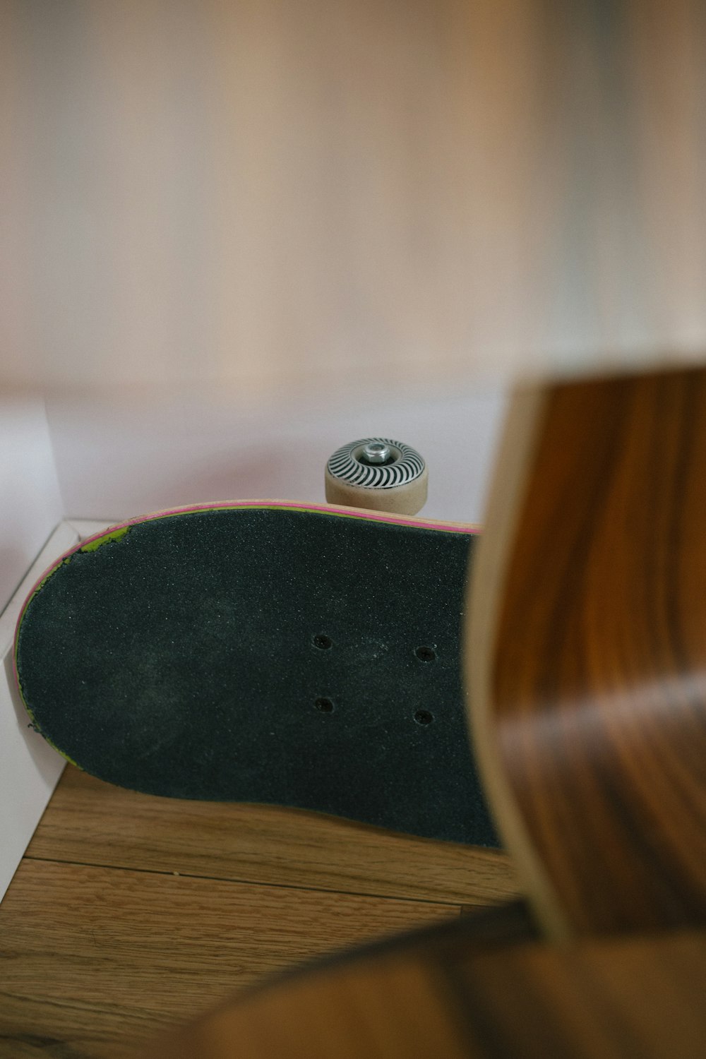 black wooden skateboard on floor
