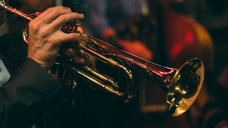 Man plays the trumpet Photo by Chris Bair on Unsplash