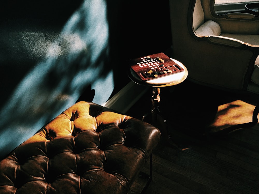 tufted brown leather bench