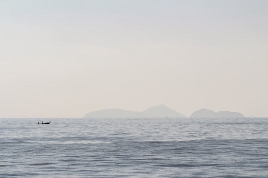 silhouette of boat sailing on ocean in Phi Phi Islands Thailand