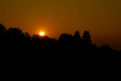 Sunset casting warm light over a group finishing a via corda adventure.