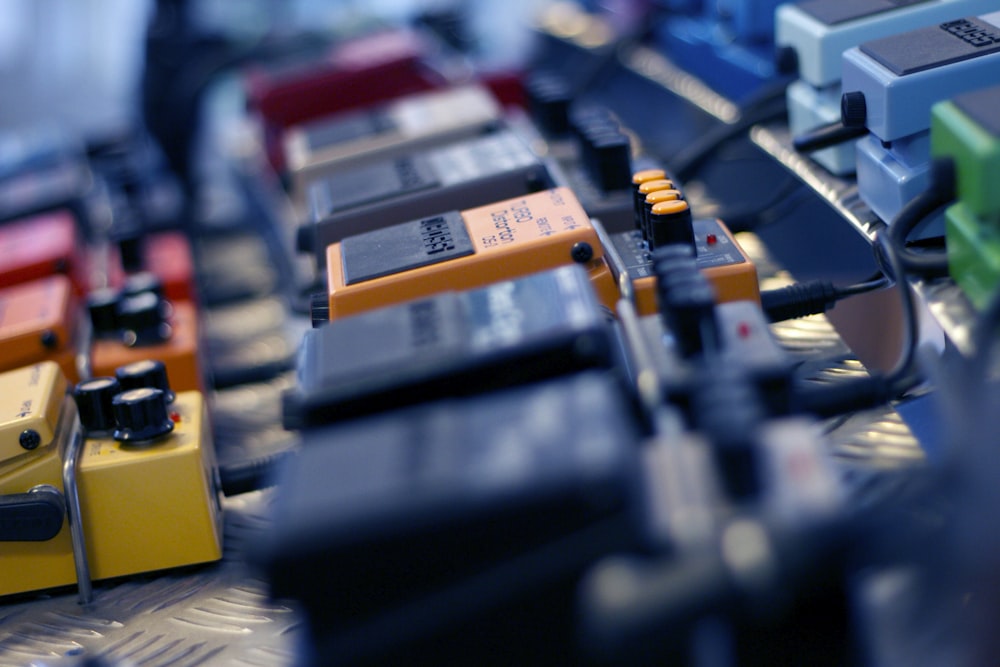 selective focus photo of guitar pedals