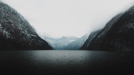 landscape photography of body of water against two mountains in Königssee Germany