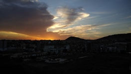 A scenic view of the city skyline at sunset, highlighting its unique character.