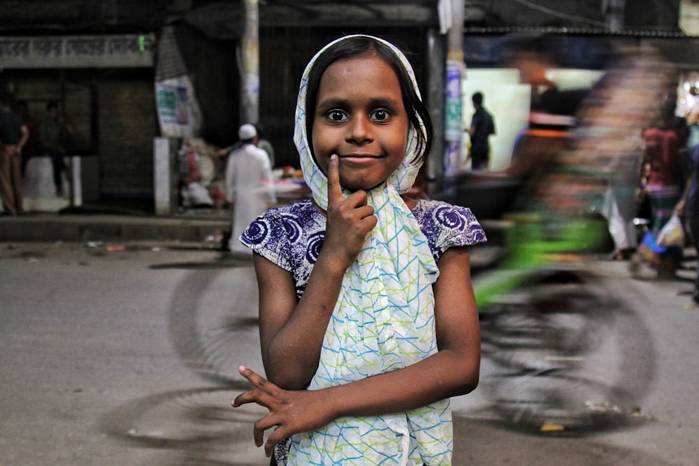 a young girl is posing for a picture