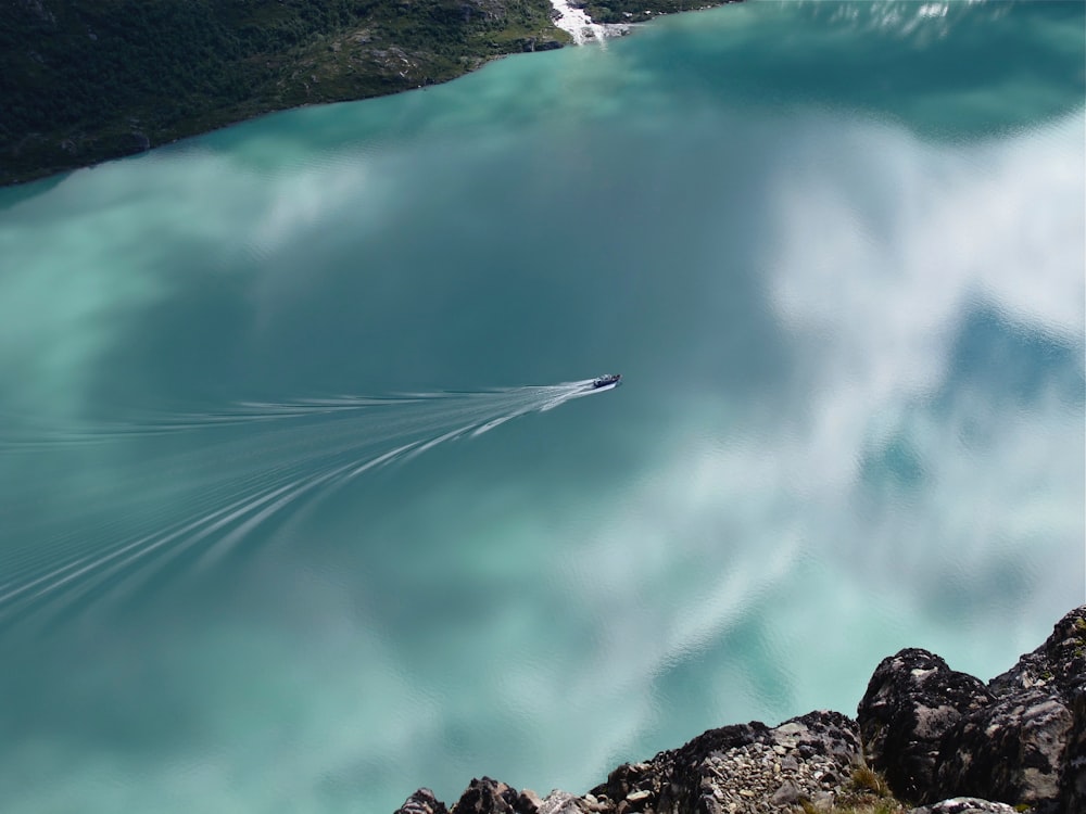 a jet skis through the air over a body of water