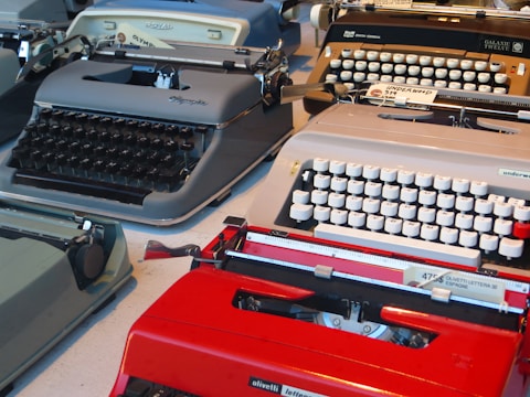 A collection of various typewriters displayed in a well-lit store.