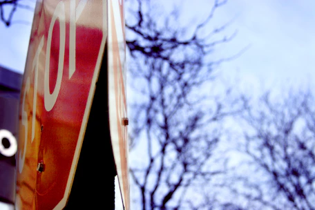 Close-up of a clear stop traffic sign on a sunny day.