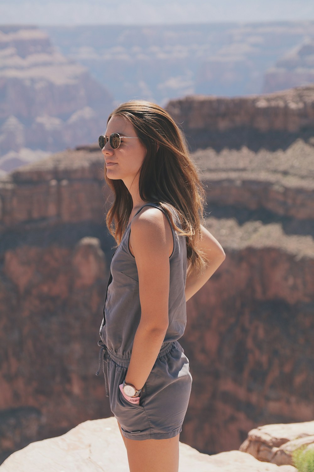 woman standing on top of mountain