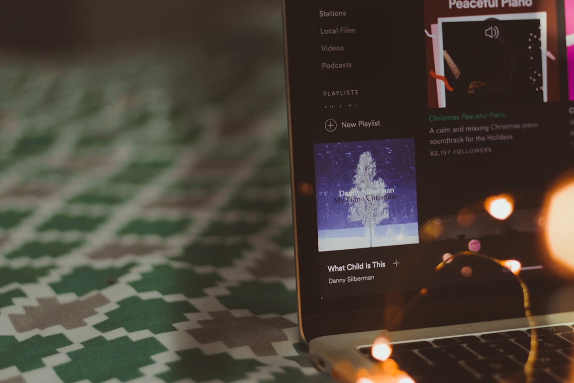 spotify playing christmas music on a laptop