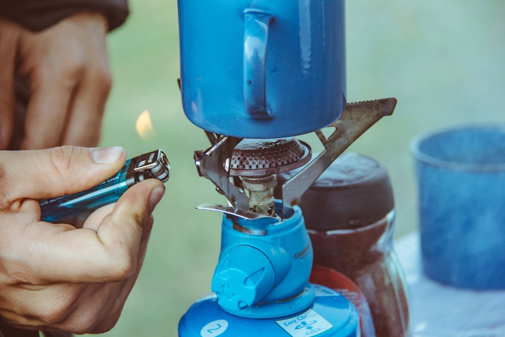 person lighted single burner using lighter