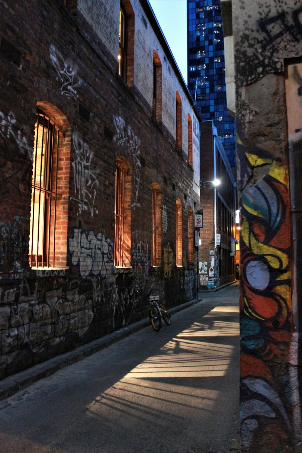 bicycle leaning on the wall near the window