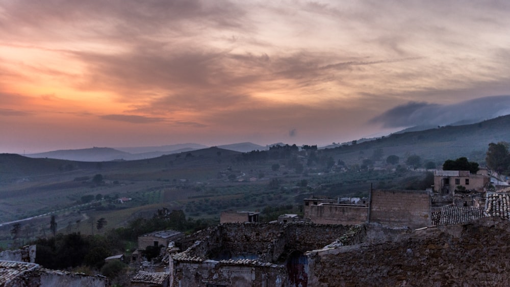 aerial view photography of village near mountain range