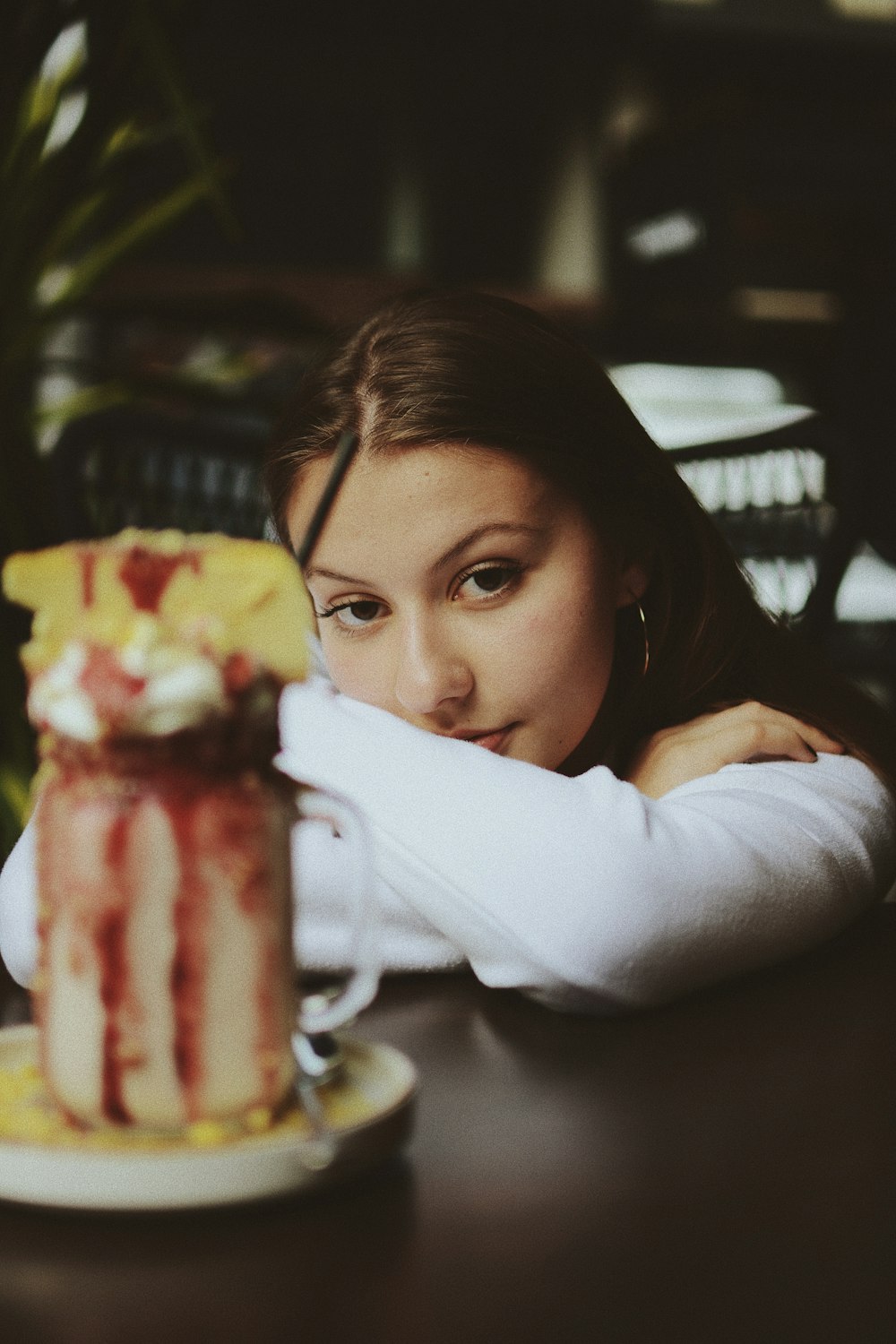 woman leaning on table