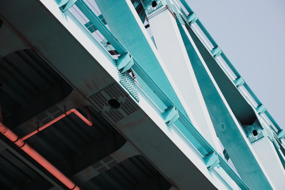 a close up of a metal structure with a sky background