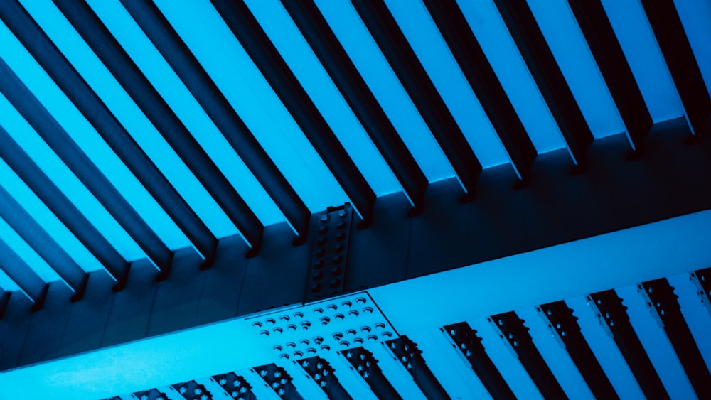 a close up of a metal structure with a blue light