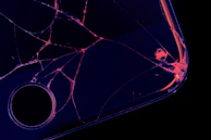 Close-up of a cracked digital encryption interface glowing with red warning signals.