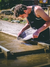 man holding basin