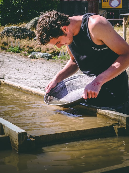 man holding basin in Arrowtown New Zealand