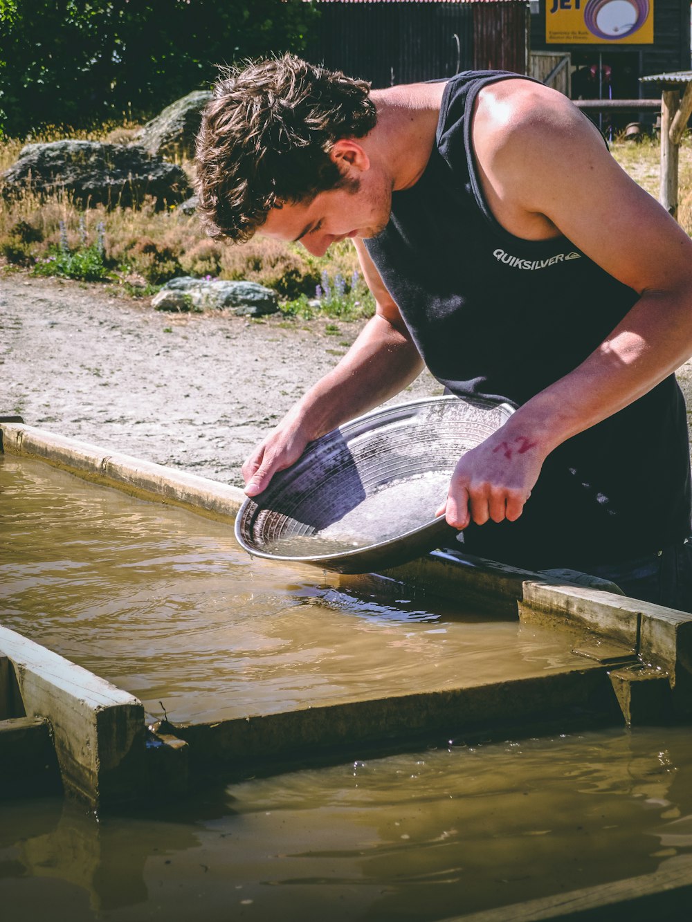 man holding basin