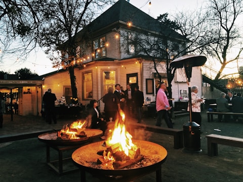 bon fire near people and house