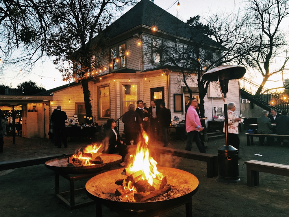 bon fire near people and house